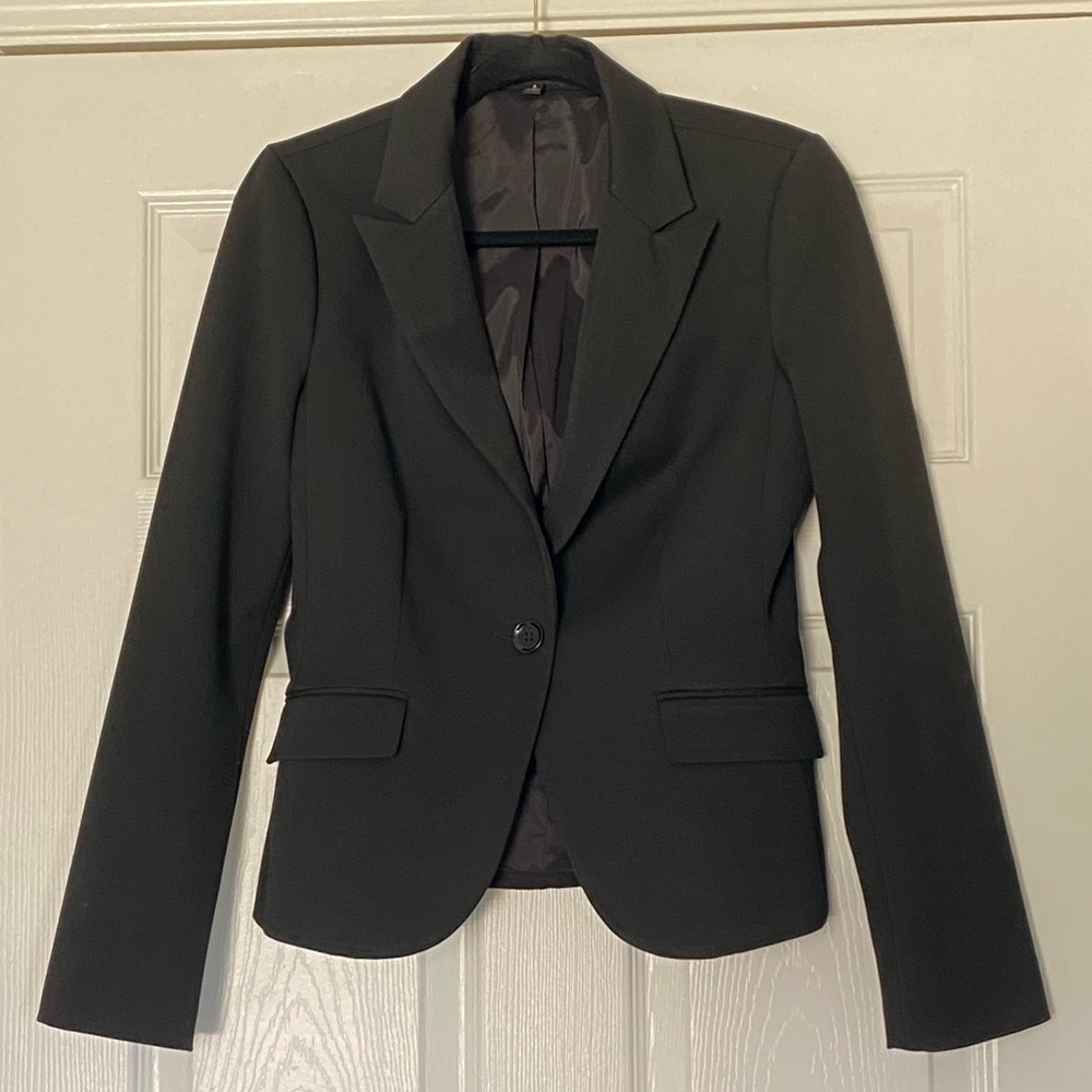 Black blazer worn once or twice. Office / professional wear.